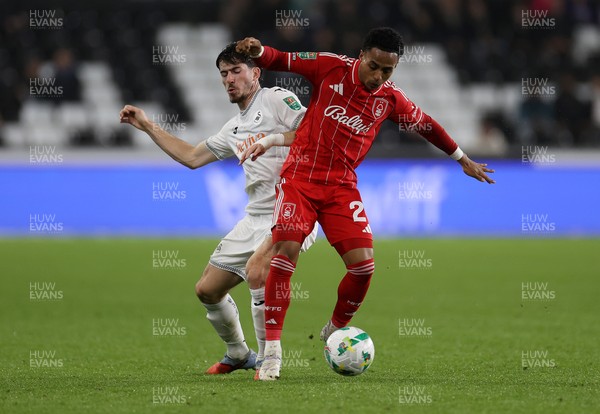 170925 - Swansea City v Nottingham Forest - Carabao Cup - Omari Hutchinson of Nottingham Forest is tackled by Josh Key of Swansea City 