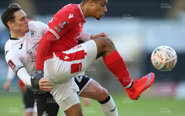 230121 - Swansea City v Nottingham Forest, FA Cup Fourth Round - Lyle Taylor of Nottingham Forest is challenged by Connor Roberts of Swansea City