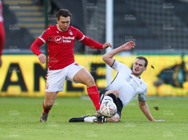230121 - Swansea City v Nottingham Forest, FA Cup Fourth Round - Luke Freeman of Nottingham Forest is tackled by Ryan Bennett of Swansea City