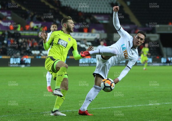 060218 - Swansea City v Notts County, FA Cup Round 4 Replay - Connor Roberts of Swansea City and Jorge Grant of Notts County compete for the ball