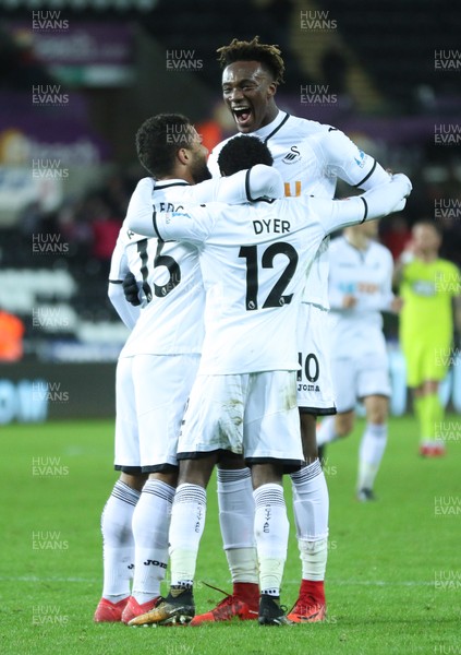 060218 - Swansea City v Notts County, FA Cup Round 4 Replay - Nathan Dyer of Swansea City celebrates with Wayne Routledge of Swansea City and Tammy Abraham of Swansea City after he scores the second goal