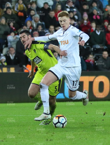 060218 - Swansea City v Notts County, FA Cup Round 4 Replay - Sam Clucas of Swansea City takes on Richard Duffy of Notts County