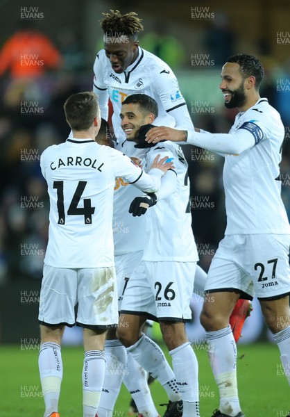 060218 - Swansea City v Notts County, FA Cup Round 4 Replay - Swansea players celebrate after Kyle Naughton of Swansea City, centre, scores the fifth goal