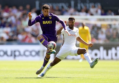 030525 - Swansea City v Oxford United - SkyBet Championship - Ruben Rodrigues of Oxford United is tackled by Hannes Delcroix of Swansea City 