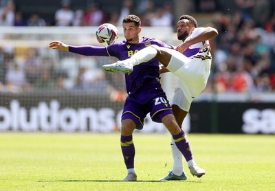 030525 - Swansea City v Oxford United - SkyBet Championship - Ruben Rodrigues of Oxford United is tackled by Hannes Delcroix of Swansea City 