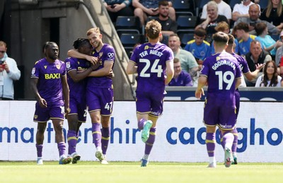 030525 - Swansea City v Oxford United - SkyBet Championship - Greg Leigh of Oxford United celebrates scoring a goal with team mates