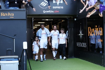 030525 - Swansea City v Oxford United - SkyBet Championship - Kyle Naughton and Joe Allen of Swansea City walk out the tunnel after game on their final game of their careers
