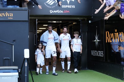 030525 - Swansea City v Oxford United - SkyBet Championship - Kyle Naughton and Joe Allen of Swansea City walk out the tunnel after game on their final game of their careers