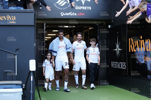 030525 - Swansea City v Oxford United - SkyBet Championship - Kyle Naughton and Joe Allen of Swansea City walk out the tunnel after game on their final game of their careers