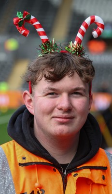 061225 - Swansea City v Oxford United, EFL Sky Bet Championship - Match stewards in the East stand get into the Christmas spirit with festive headwear