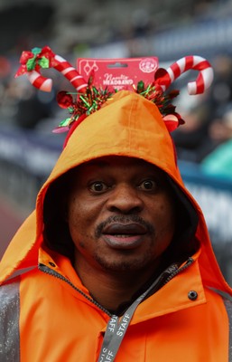 061225 - Swansea City v Oxford United, EFL Sky Bet Championship - Match stewards in the East stand get into the Christmas spirit with festive headwear