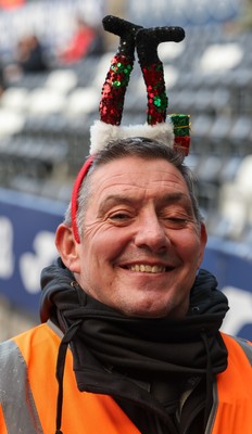 061225 - Swansea City v Oxford United, EFL Sky Bet Championship - Match stewards in the East stand get into the Christmas spirit with festive headwear