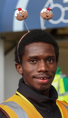 061225 - Swansea City v Oxford United, EFL Sky Bet Championship - Match stewards in the East stand get into the Christmas spirit with festive headwear