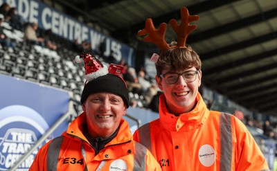 061225 - Swansea City v Oxford United, EFL Sky Bet Championship - Match stewards in the East stand get into the Christmas spirit with festive headwear