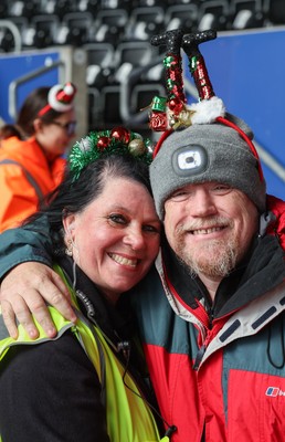 061225 - Swansea City v Oxford United, EFL Sky Bet Championship - Match stewards in the East stand get into the Christmas spirit with festive headwear