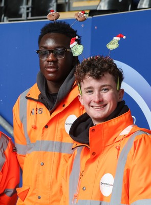 061225 - Swansea City v Oxford United, EFL Sky Bet Championship - Match stewards in the East stand get into the Christmas spirit with festive headwear