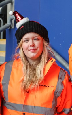 061225 - Swansea City v Oxford United, EFL Sky Bet Championship - Match stewards in the East stand get into the Christmas spirit with festive headwear