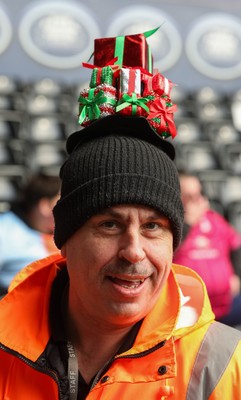 061225 - Swansea City v Oxford United, EFL Sky Bet Championship - Match stewards in the East stand get into the Christmas spirit with festive headwear