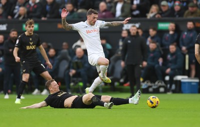 061225 - Swansea City v Oxford United, EFL Sky Bet Championship - Josh Tymon of Swansea City is challenged by Brian De Keersmaecker of Oxford United