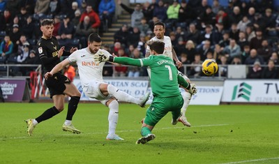 061225 - Swansea City v Oxford United, EFL Sky Bet Championship - Zan Vipotnik of Swansea City beats Oxford United goalkeeper Jamie Cumming but the goal is ruled out for offside