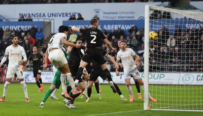 061225 - Swansea City v Oxford United, EFL Sky Bet Championship - Marko Stamenic of Swansea City heads to score the opening goal
