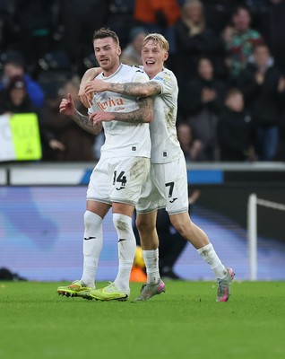 061225 - Swansea City v Oxford United, EFL Sky Bet Championship - Josh Tymon of Swansea City is congratulated by Josh Key of Swansea City after scoring the second goal