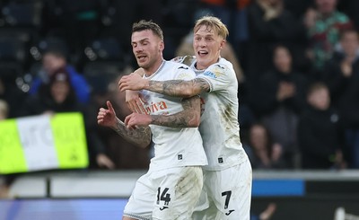 061225 - Swansea City v Oxford United, EFL Sky Bet Championship - Josh Tymon of Swansea City is congratulated by Josh Key of Swansea City after scoring the second goal