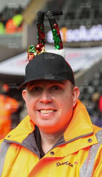 061225 - Swansea City v Oxford United, EFL Sky Bet Championship - Match stewards in the East stand get into the Christmas spirit with festive headwear