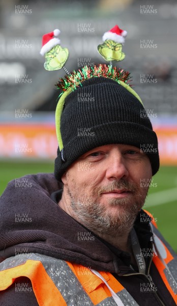 061225 - Swansea City v Oxford United, EFL Sky Bet Championship - Match stewards in the East stand get into the Christmas spirit with festive headwear