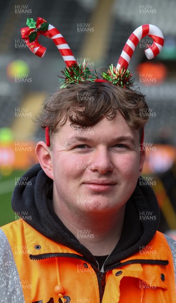 061225 - Swansea City v Oxford United, EFL Sky Bet Championship - Match stewards in the East stand get into the Christmas spirit with festive headwear
