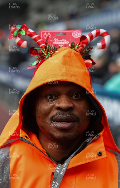 061225 - Swansea City v Oxford United, EFL Sky Bet Championship - Match stewards in the East stand get into the Christmas spirit with festive headwear