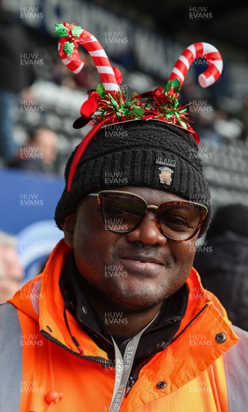 061225 - Swansea City v Oxford United, EFL Sky Bet Championship - Match stewards in the East stand get into the Christmas spirit with festive headwear