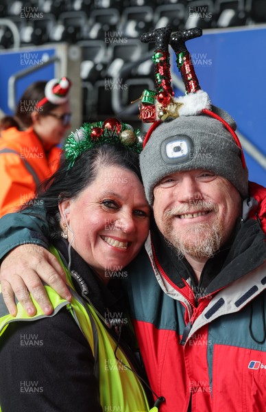 061225 - Swansea City v Oxford United, EFL Sky Bet Championship - Match stewards in the East stand get into the Christmas spirit with festive headwear