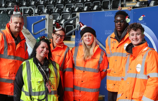 061225 - Swansea City v Oxford United, EFL Sky Bet Championship - Match stewards in the East stand get into the Christmas spirit with festive headwear
