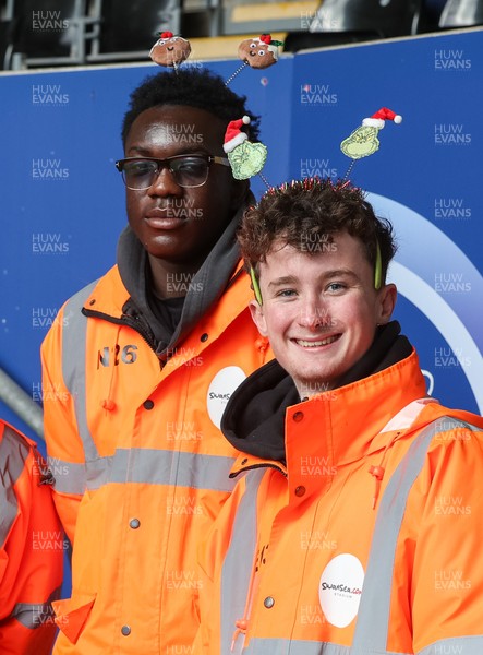 061225 - Swansea City v Oxford United, EFL Sky Bet Championship - Match stewards in the East stand get into the Christmas spirit with festive headwear