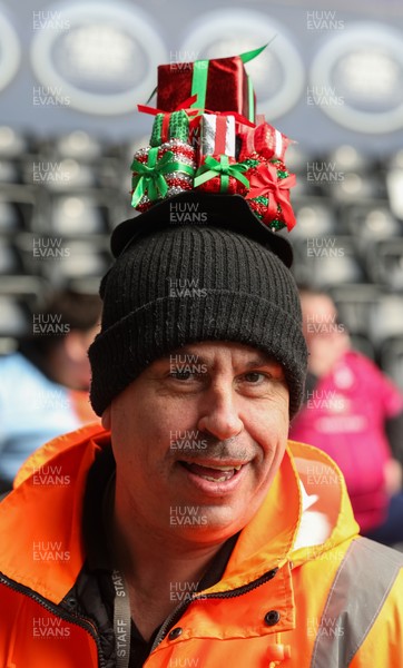 061225 - Swansea City v Oxford United, EFL Sky Bet Championship - Match stewards in the East stand get into the Christmas spirit with festive headwear