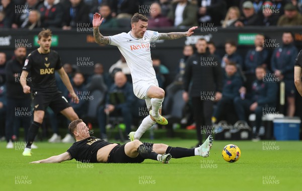 061225 - Swansea City v Oxford United, EFL Sky Bet Championship - Josh Tymon of Swansea City is challenged by Brian De Keersmaecker of Oxford United