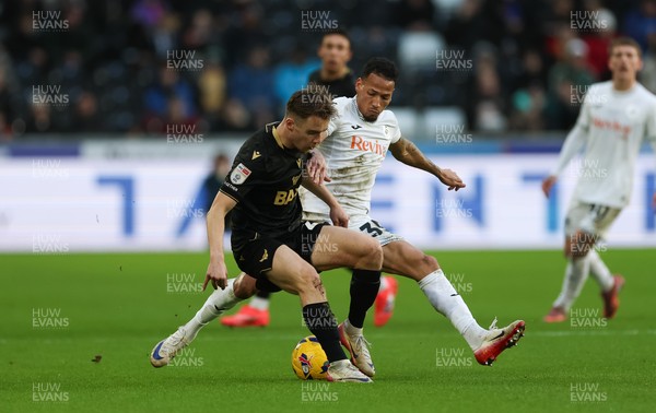 061225 - Swansea City v Oxford United, EFL Sky Bet Championship - Jack Currie of Oxford United is tackled by Ronald of Swansea City