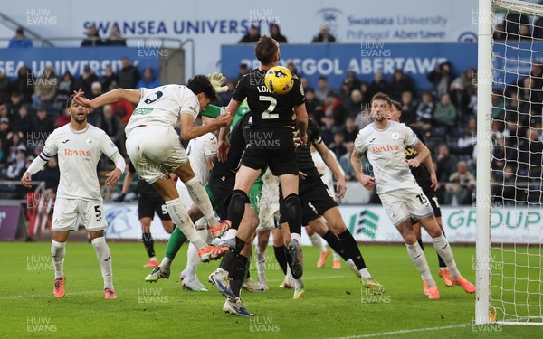 061225 - Swansea City v Oxford United, EFL Sky Bet Championship - Marko Stamenic of Swansea City heads to score the opening goal
