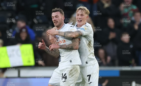 061225 - Swansea City v Oxford United, EFL Sky Bet Championship - Josh Tymon of Swansea City is congratulated by Josh Key of Swansea City after scoring the second goal