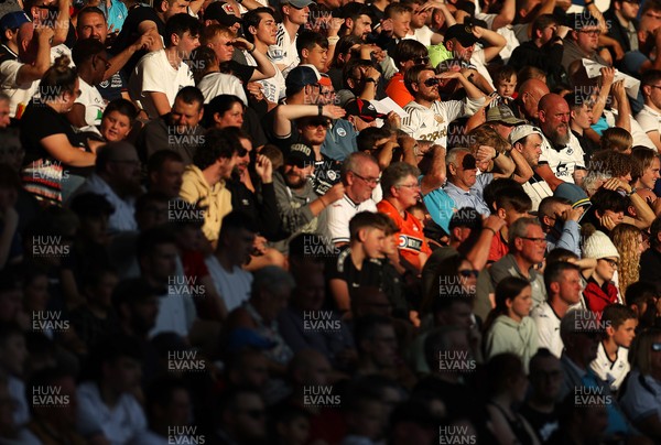 240821 - Swansea City v Plymouth Argyle - Carabao Cup - Swansea fans watch the game in the sun