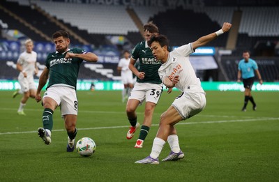260825 - Swansea City v Plymouth Argyle - Carabao Cup - Eom Ji-Sung of Swansea City is challenged by Joe Edwards of Plymouth Argyle 