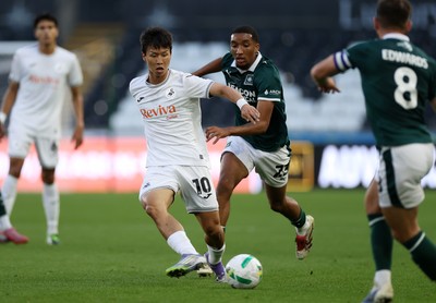 260825 - Swansea City v Plymouth Argyle - Carabao Cup - Eom Ji-Sung of Swansea City is challenged by Bradley Ibrahim of Plymouth Argyle 