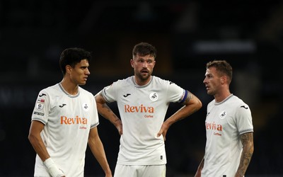 260825 - Swansea City v Plymouth Argyle - Carabao Cup - Marko Stamenic, Cameron Burgess and Josh Tymon of Swansea City 