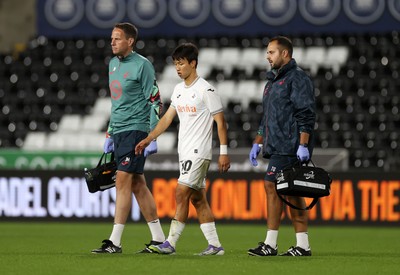 260825 - Swansea City v Plymouth Argyle - Carabao Cup - Eom Ji-Sung of Swansea City leaves the field injured