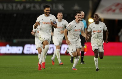 260825 - Swansea City v Plymouth Argyle - Carabao Cup - Ben Cabango, Josh Key and Malick Yalcouye of Swansea City celebrate as Swansea win on penalties 