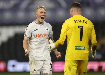 260825 - Swansea City v Plymouth Argyle - Carabao Cup - Melker Widell and Andy Fisher of Swansea City celebrate after the team win on penalties
