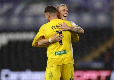 260825 - Swansea City v Plymouth Argyle - Carabao Cup - Melker Widell and Andy Fisher of Swansea City celebrate after the team win on penalties