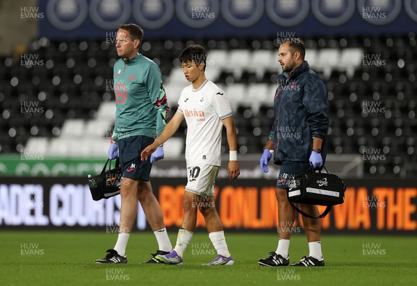 260825 - Swansea City v Plymouth Argyle - Carabao Cup - Eom Ji-Sung of Swansea City leaves the field injured