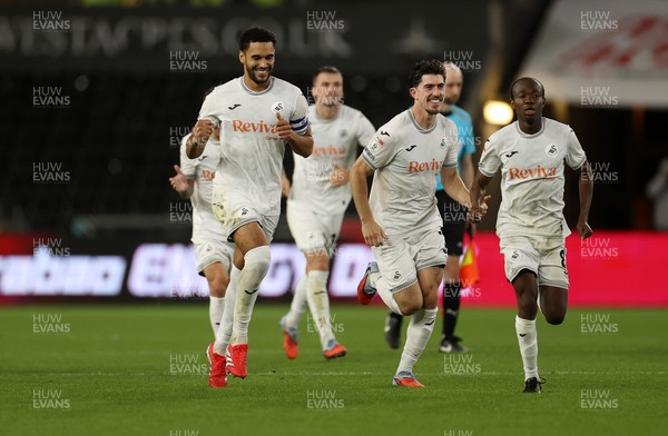 260825 - Swansea City v Plymouth Argyle - Carabao Cup - Ben Cabango, Josh Key and Malick Yalcouye of Swansea City celebrate as Swansea win on penalties 